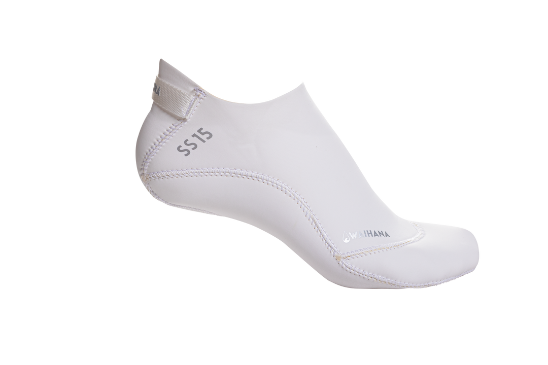 White Waihana SS15 neoprene dive sock with stitched sole and pull tab, displayed in profile against a black studio background.