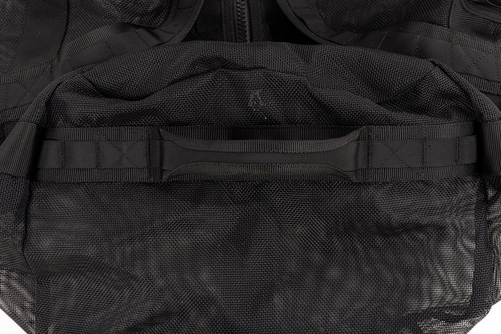 Close-up of the reinforced top carry handle and textured mesh fabric on the Waihana Expedition Duffel bag in black.