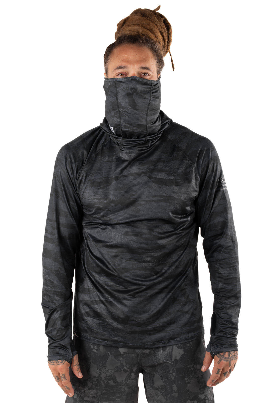 Male model with dreadlocks wearing a Waihana Tropicam Black long-sleeve sun shirt with built-in face gaiter pulled up, shown from the front on a white background.